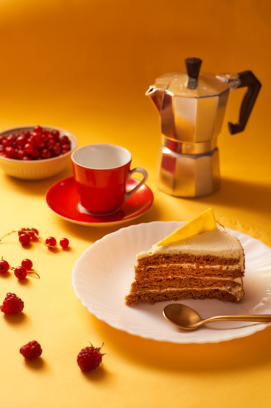 Honey cake, Red cup of coffee and a geyser coffee 