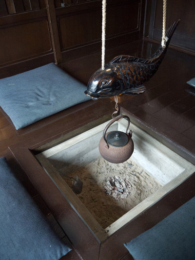 Lapanese house interior with irori fireplace, carv