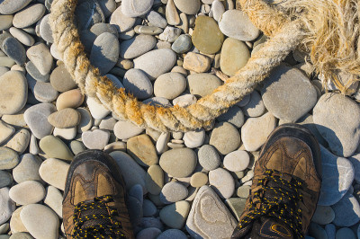old marine rope on the pebble beach