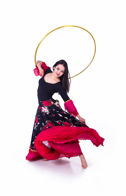 Young girl dancing with a Hoop.