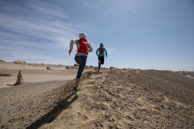 Two women trail runners cross country running in t