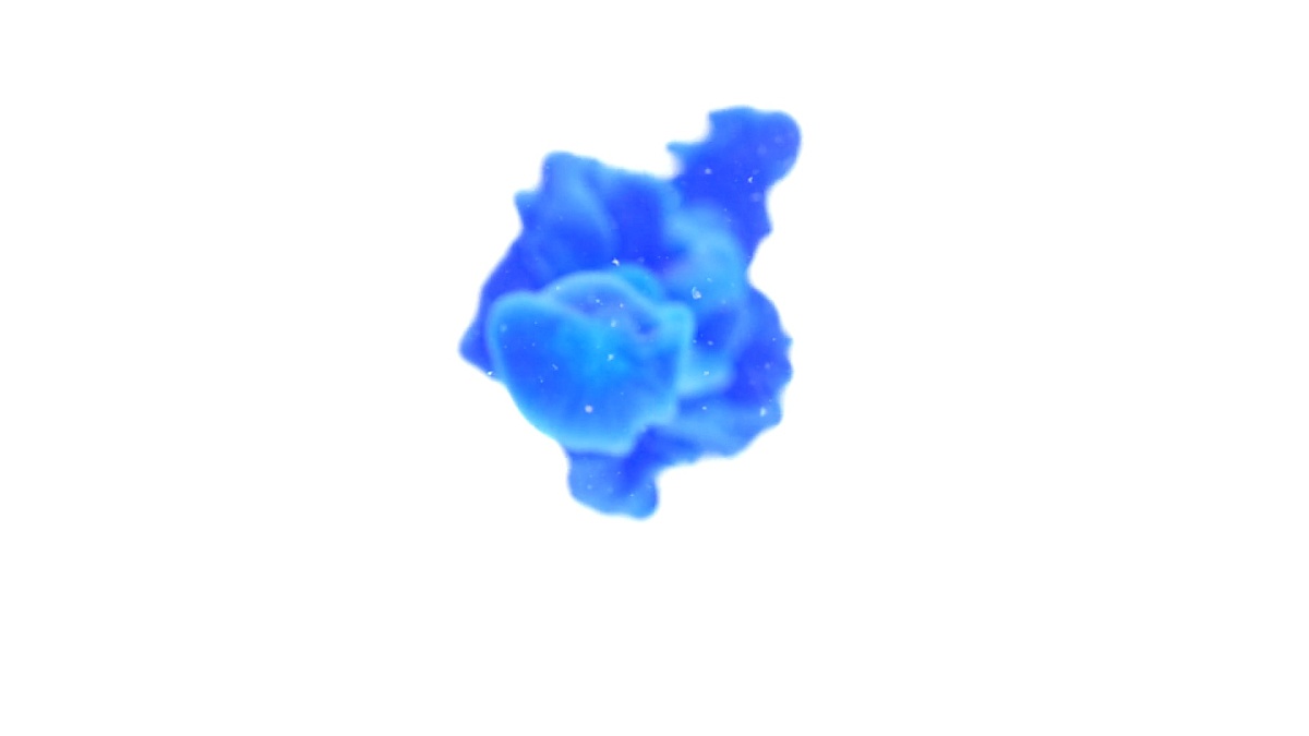 Dropping blue ink paint exploding in water abstract background