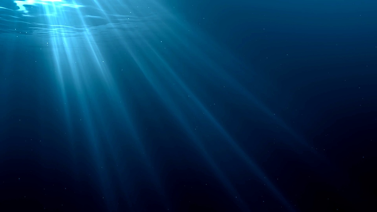 阳光穿过海洋表面。从水下观看。3D渲染的无缝循环动画。