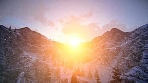 白雪皑皑的山脊上的日落
