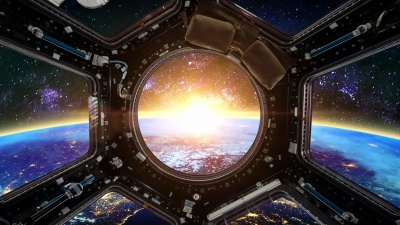 地球和宇宙飞船在日出时。这张图片的元素由NASA提供。