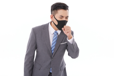 人物系列实景带着口罩咳嗽的职业男性