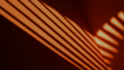 Time lapse shadows passing over orange wall