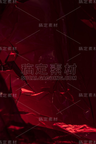 塑料闪亮看穿抽象闪烁折痕背景红色