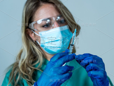 Doctor, nurse, scientist hand in blue gloves holdi