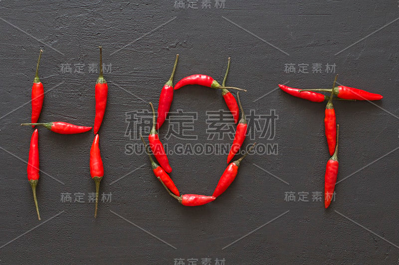 单词Hot Red Hot Chili Peppers On Black Dark Backgrou