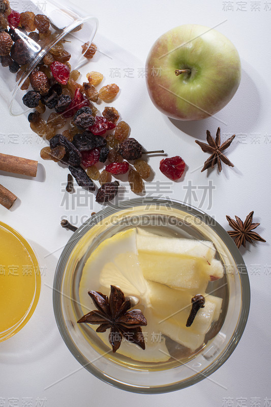 Top view on glasses with white mulled wine, sliced