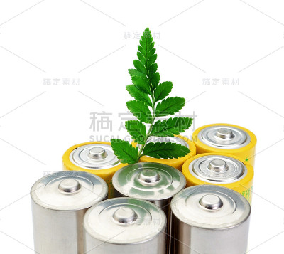 碱性电池和绿色的叶子象征着清洁能源。