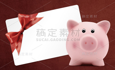 礼品卡上有储蓄罐、红丝带、红蝴蝶结
