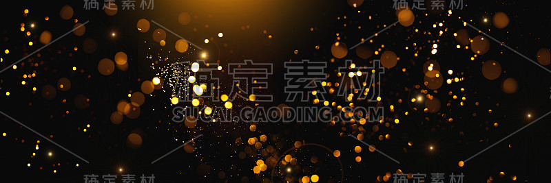 黑色背景上的金色抽象散景。