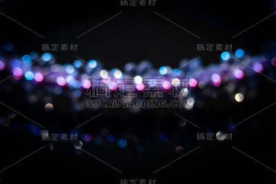 美丽的紫色散景背景由灯光创造