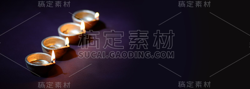粘土灯盏在排灯节庆祝期间点燃。问候卡设计印度的光节日称为排灯节