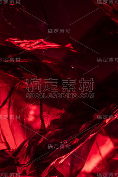 塑料闪亮看穿抽象闪烁折痕背景红色