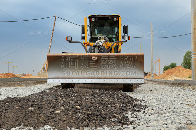 工程机械某建筑工地的平地机
