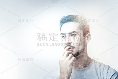 站在郊区背景下的深思熟虑的年轻人