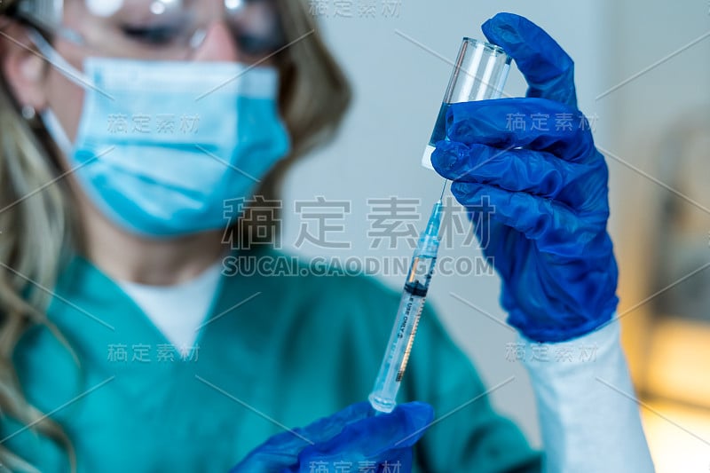 Doctor, nurse, scientist hand in blue gloves holdi