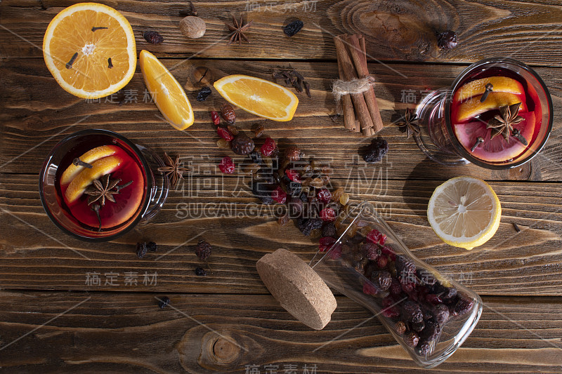 Top view of two glasses with mulled wine with an o