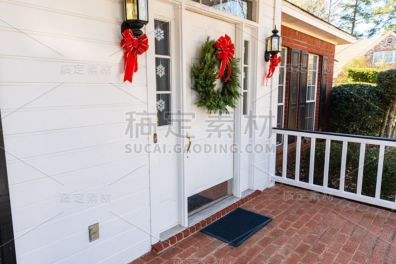 Front Porch and door decorated for the Christmas h