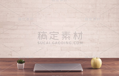 白色砖墙的办公桌特写