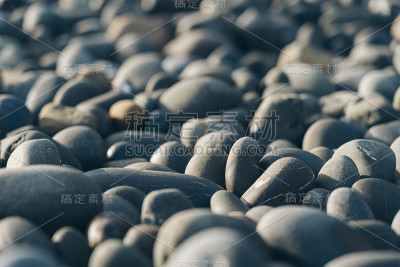 光滑的圆卵石;自然背景。纹理