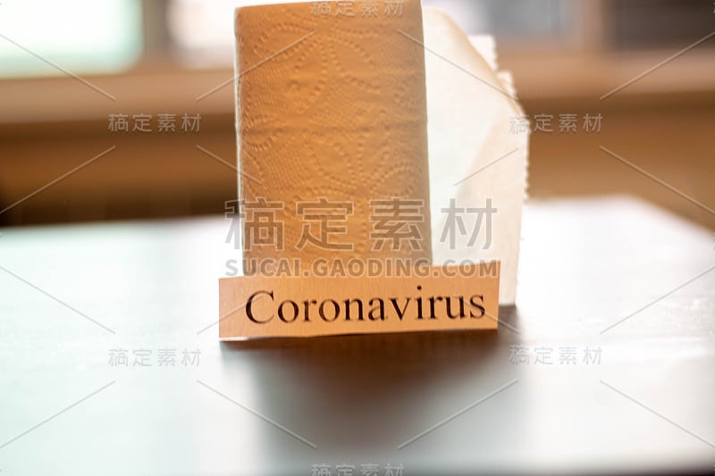 Coronavirus sign next to toilet paper. Theme of st