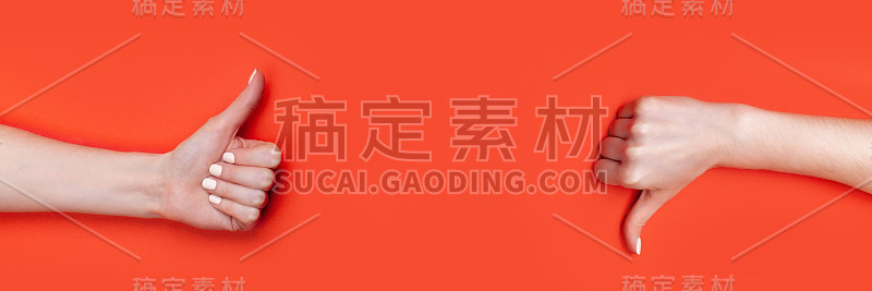 女人的手大拇指向上，大拇指向下