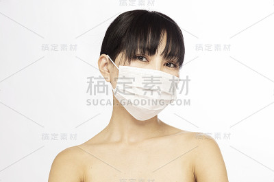 冠状病毒-特写年轻妇女在防护医疗口罩