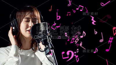 录制歌曲概念。年轻的亚洲女歌手。