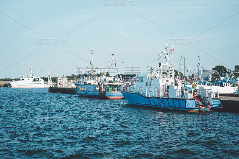 Ships or boats in the harbor