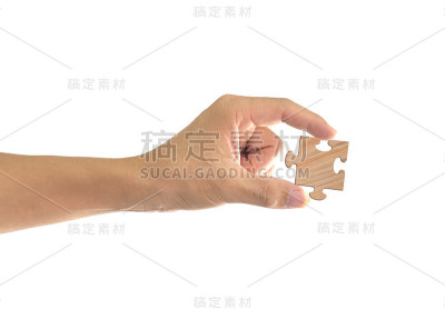 手握拼图孤立在白色背景。