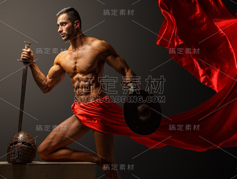 Muscular guy holding sword and shield