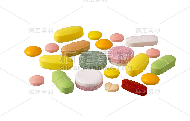 平板电脑和药。一堆五颜六色的药片、胶囊和药丸。