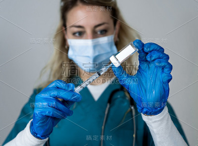 Doctor, nurse, scientist hand in blue gloves holdi