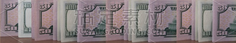 50美元和100美元的钞票特写。古典风格的着色
