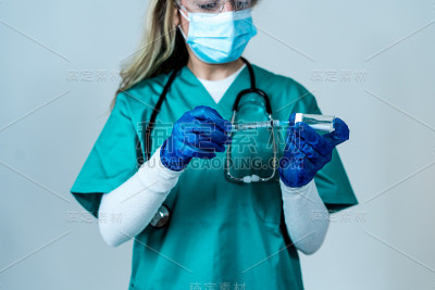 Doctor, nurse, scientist hand in blue gloves holdi