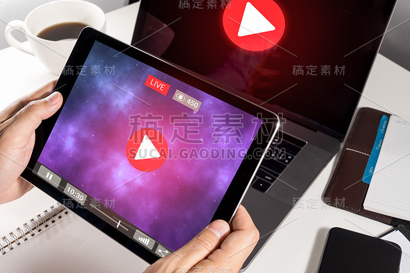 Man Hand Holding Tablet with Live Streaming with M