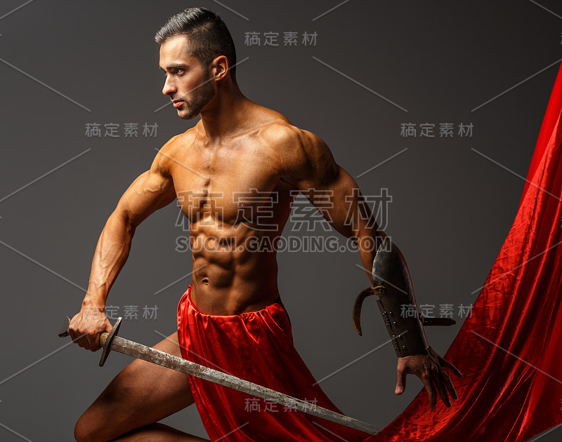 Shirtless guy holding sword