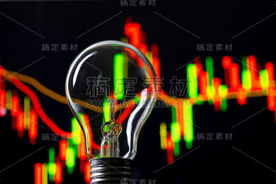 商业成功与股票图表和灯泡