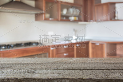 模糊的背景。现代厨房与桌面和空间为您。