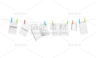 把练习本放在绳子上