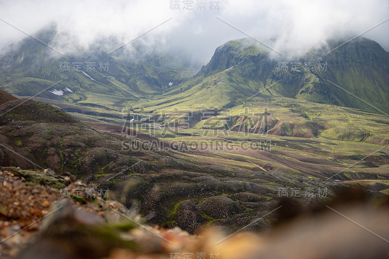 View mountain valley with green, foggy hills. Laug