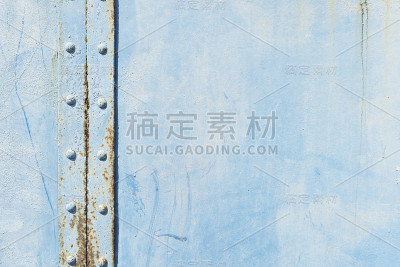 蓝色钢板和铆钉与一些生锈的背景