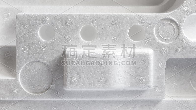 产品包装用聚苯乙烯或聚苯乙烯泡沫塑料衬垫。详细说明苯乙烯泡沫塑料盒的特写。